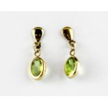 A pair of 9ct yellow gold (stamped 9ct) peridot set drop earrings, L. 1.8cm.