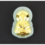 A small high carat gold fronted nephrite jade Chinese amulet of the goddess Guayin, H. 3cm.
