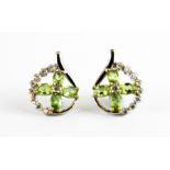 A pair of 925 silver peridot and white stones set earrings.