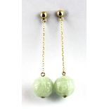 A pair of 14ct yellow gold (stamped 14k) carved jade set drop earrings, L. 4cm, (one butterfly