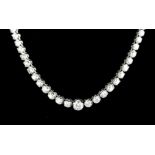 An 18ct white gold (stamped 750) graduated necklace set with 13ct of brilliant cut diamonds, L.