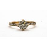 An 18ct rose gold (stamped 750) solitaire ring set with a 1ct brilliant cut diamond and diamond