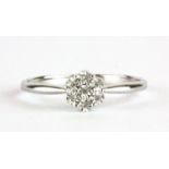 A 9ct white gold diamond set cluster ring, (N.5).