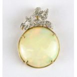 A 14ct yellow gold (stamped 585) pendant set with a large cabochon cut opal and diamonds, opal