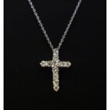 An 18ct white gold (stamped 750) brilliant cut diamond set cross pendant and chain, approx. 1.