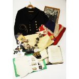 A box of mixed personal memorabilia including a naval jacket, union jack, scouting items and