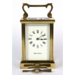 A Mappin & Webb brass carriage clock, H. 12cm. With key.
