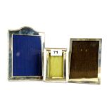 Three hallmarked silver picture frames, tallest H. 19cm.