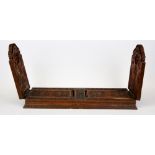 A 19th Century Chinese carved wooden sliding book rack, L. 34cm.