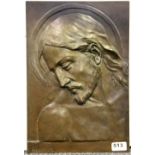 A bronze wall plaque of Jesus signed E. Greiner, 27 x 28cm.