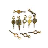 A small group of antique watch keys.