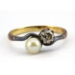 A yellow metal (minimum 9ct gold) pearl and diamond set crossover ring, (N.5).