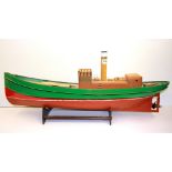 A hand painted wooden model of a steam tug, L. 88cm.