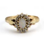 A 9ct yellow gold opal and white stone cluster ring, (P.5).
