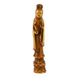 An early 20th Century Chinese carved ivory figure of the goddess Guanyin, H. 21cm.