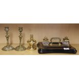 A 20th Century brass decorated desk stand with a pair of brass candlesticks and a further