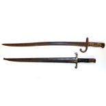 Two 19th Century bayonets, one with scabbard, L. 70cm L. 61cm.