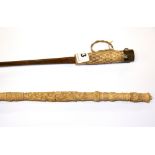 An Edwardian carved ivory handled parasol and a carved ivory handled sword stick without sheath,