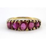 A Victorian 18ct yellow gold (worn stamp 18ct) ring set with five untreated oval cut rubies, (J.5).