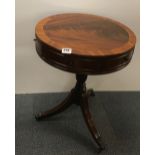 A 20th Century mahogany drum table, Dia. 50cm H. 65cm.