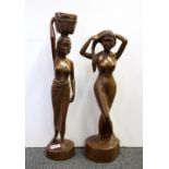 Two Indonesian carved hardwood figures of young women, H. 56cm H. 50cm.
