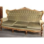 An Victorian button back green upholstered three seater settee, L. 190cm, D. 100cm.