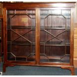 A mahogany veneered glass fronted bookcase, 122 x 120 x 33cm.