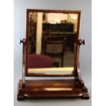 A Regency mahogany veneered dressing table mirror, H. 65cm W. 53cm.