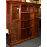 A carved oak bookcase, 134 x 140 x 25cm.