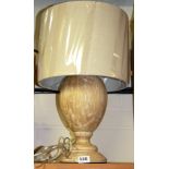 A contemporary wooden table lamp with beige linen shade, H. 54cm.