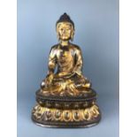 An impressive temple quaity Tibetan gilt bronze figure of the seated Buddha, H. 60cm.