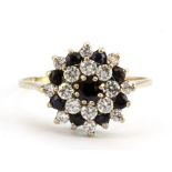 A 9ct yellow gold sapphire and white stone set large cluster ring, (V.5).