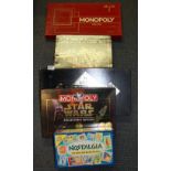 Three special editions Monopoly board games and two further board games.