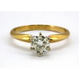 An 18ct yellow gold (stamped 18k) brilliant cut diamond set solitaire ring, approximately 0.75ct, (