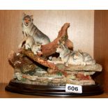 A Royal Doulton resin figure of a wolf family in the forest, H. 221cm.
