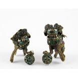 A pair of miniature enamelled Chinese filigree dancing articulated lion dog figures, H. 4cm L. 4cm.