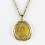 A 9ct yellow gold mounted full sovereign on a 9ct gold chain, c. 1983.
