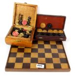 A marquetry wooden chessboard ( 32 x 32 cms ) with a set of antique ivory draughts ( 3.5 x .8 cms),