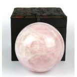 A boxed rose quartz crystal ball, Dia. Approximately 11cm.