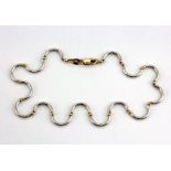 A 9ct yellow and white gold bracelet, L. 18cm.