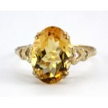 A 9ct yellow gold ring set with an oval cut citrine, (V).