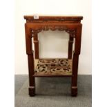 A Chinese carved hardwood side table, H. 76cm.