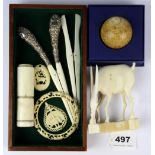 A quantity of antique carved ivory and bone items including a pair of hallmarked silver handled