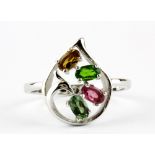 A 925 silver ring set with mixed colour oval cut tourmalines, (S).