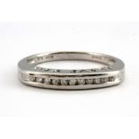 A 9ct white gold diamond set half eternity ring, with "I LOVE YOU" pierced on the shank, (N.5).