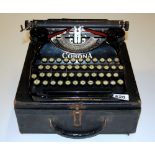 A vintage cased portable Corona typewriter, 34 x 30 x 13cm.