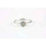 A 9ct white gold diamond set cluster ring, (N.5).