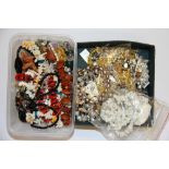 Two boxes of mixed gemstone, pearl and other necklaces.