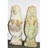 A pair of 19th Century carved sandstone garden sculptures in the shape of guardian lions holding