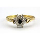 An 18ct yellow gold sapphire and diamond set cluster ring, (O).